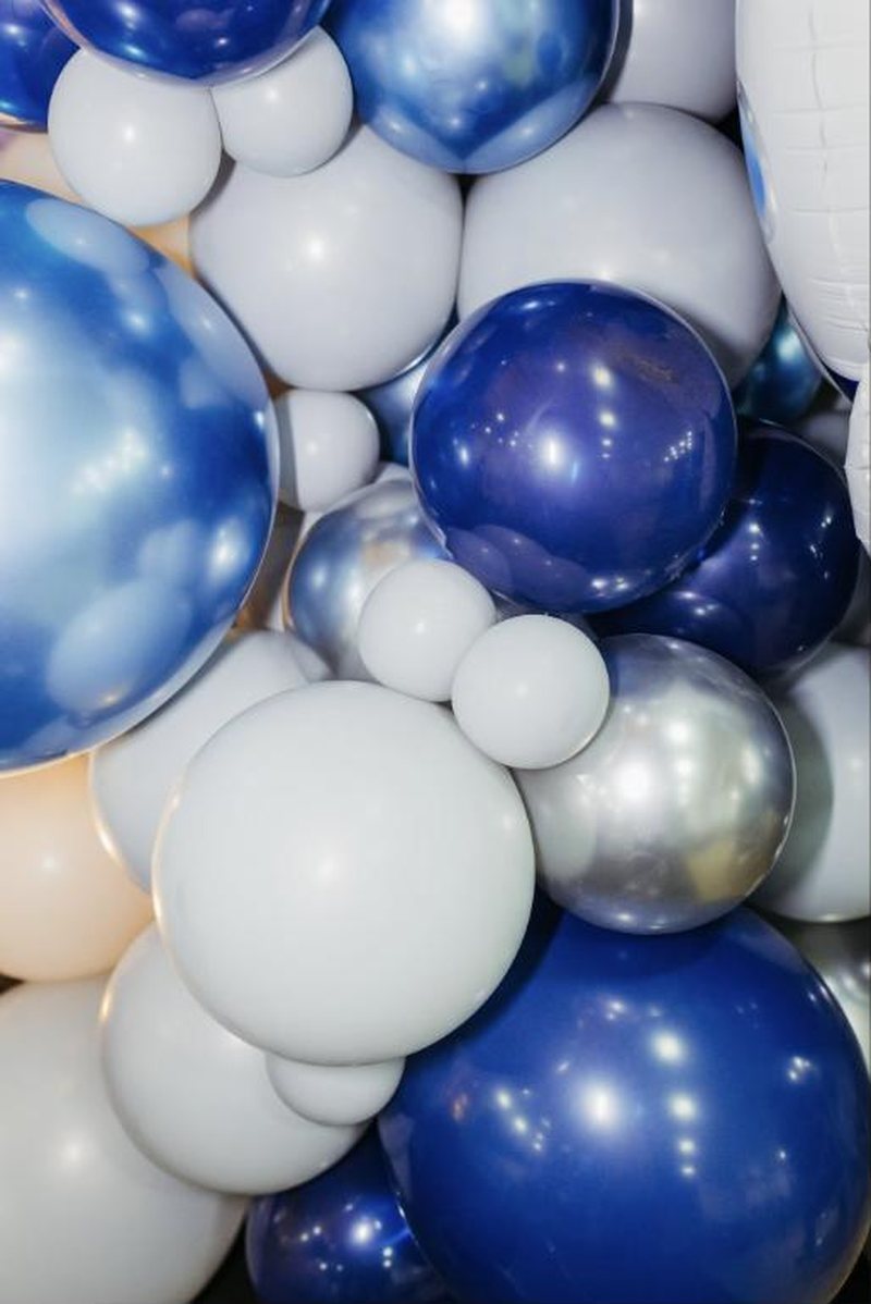 Navy, silver and white balloon installation up close